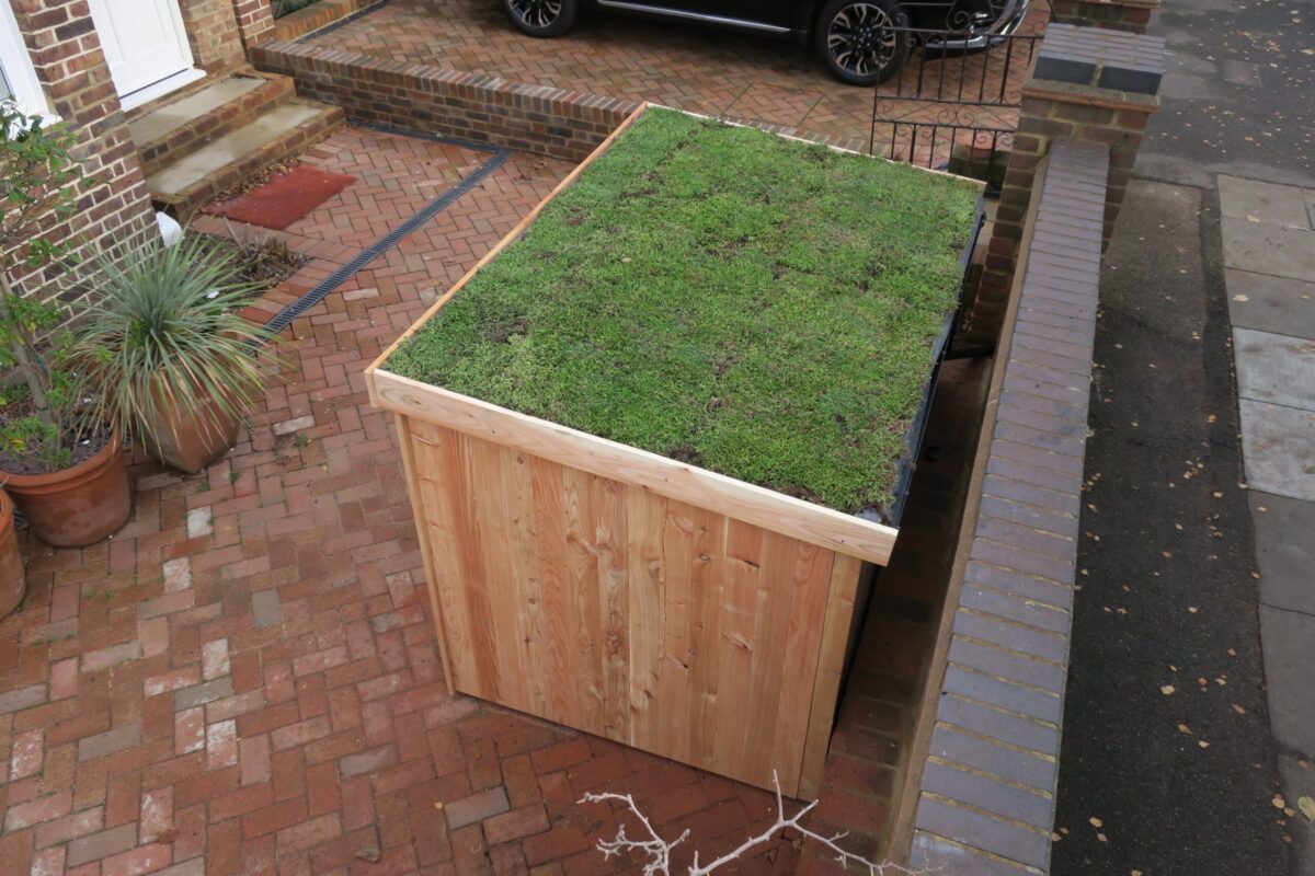 Bike shed with a living green roof in a garden setting (5 of 6)