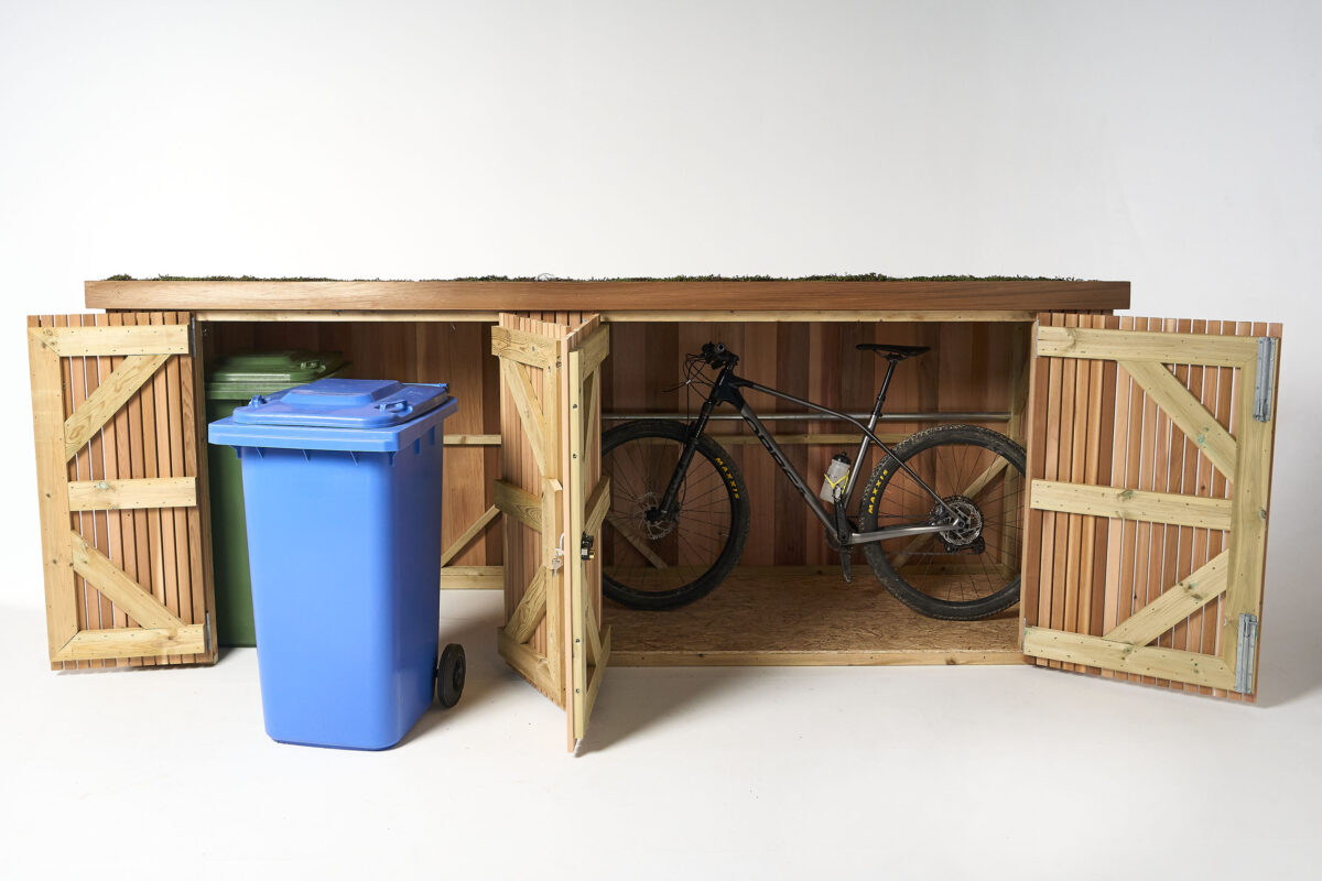 Bikes stored in a Slot-In Bike Shed, featured in a guide to storing bins decoratively