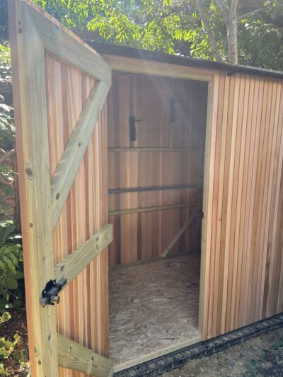 Bike hung inside a shed on the integrated powder-coated hooks